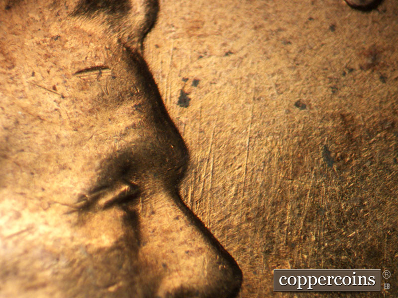 Die-stage B marker on 1960D•1DO•005 showing N/S die scratches from nose.