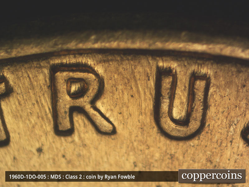 Die-stage C marker on 1960D•1DO•005 showing Light doubling on TRUST.