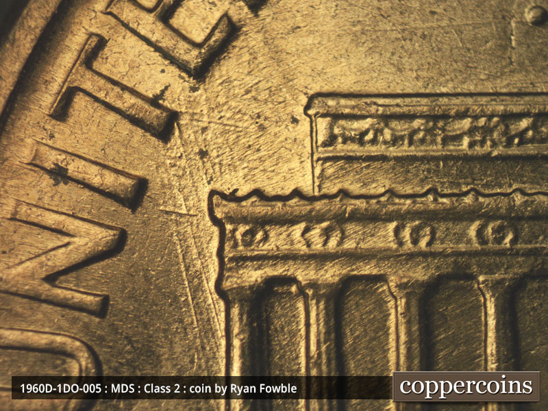 Die-stage C marker on 1960D•1DO•005 showing NNW die scratches from column 1.
