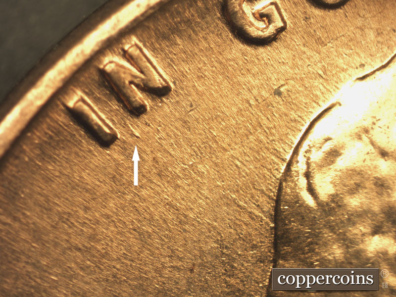 Die-stage B marker on 1960D•1DO•006 showing Die dot between I and N.