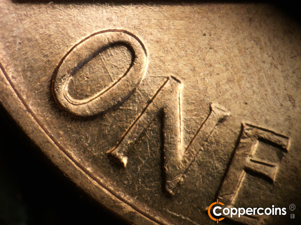 Die-stage C marker on 1960D•1DO•007 showing Concentric scratch in O of ONE.