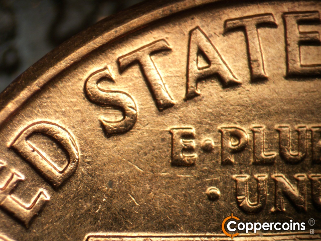 Die-stage B marker on 1960D•1DO•008 showing Die scratches through ST in STATES incliding one that connect the S to the E in E PLURIBUS.