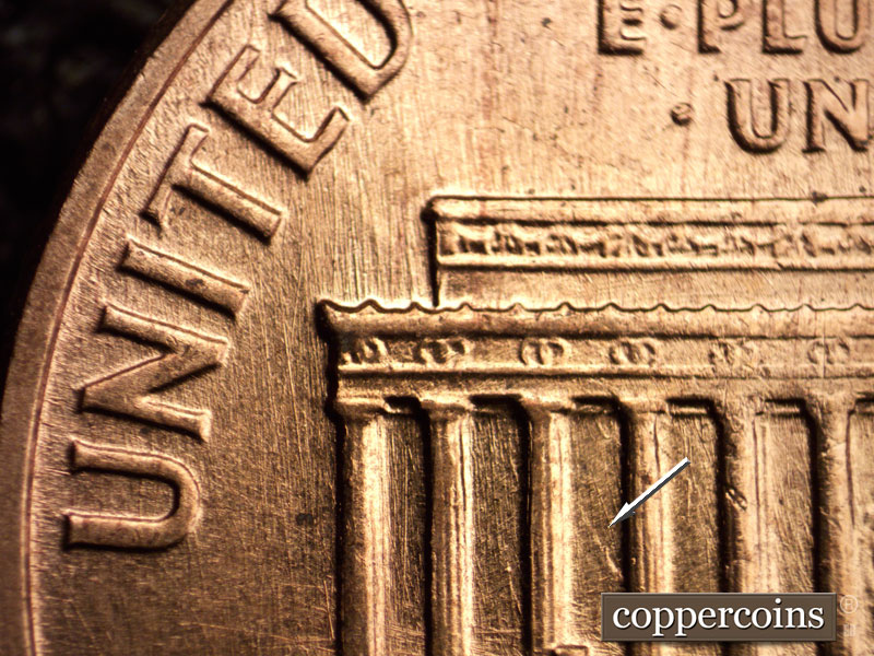 Die-stage B marker on 1960D•1MM•001 showing Die clash in bay 3 sse die scratches from rim through UNITED.