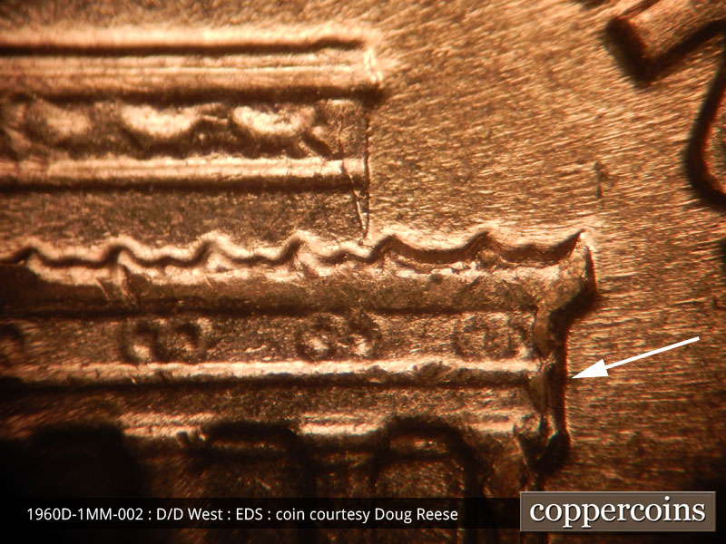 Die-stage A marker on 1960D•1MM•002 showing Die chip on right cornice.