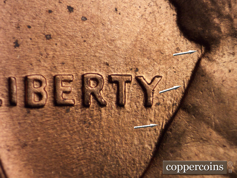 Die-stage B marker on 1960D•1MM•002 showing Worn N/S die scratches through TY in LIBERTY.