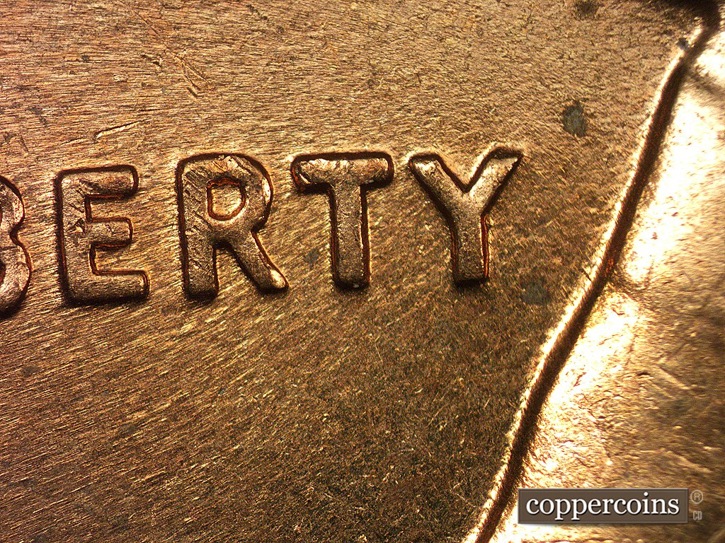 Die-stage C marker on 1960D•1MM•002 showing None of the markers for Stage B remain aroind the TY of LIBERTY.
