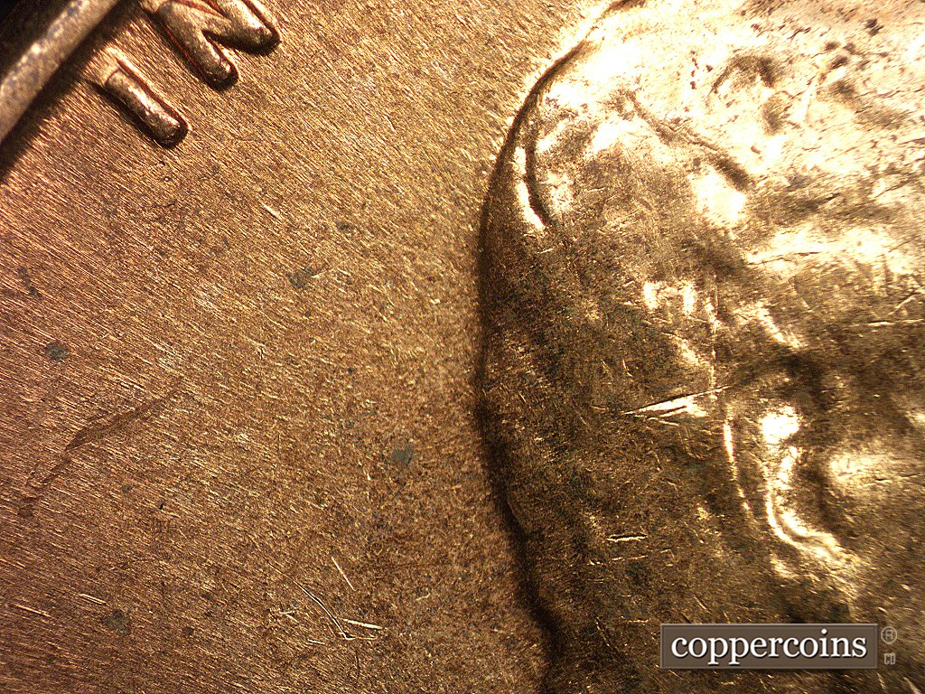 Die-stage C marker on 1960D•1MM•002 showing No die scratch at the back of Lincoln's head.