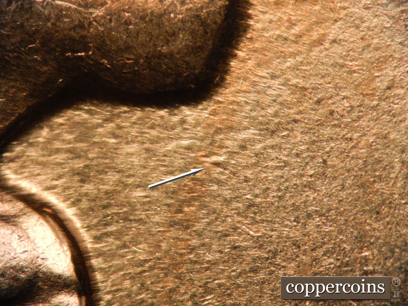 Die-stage D marker on 1960D•1MM•002 showing Die dot under chin.