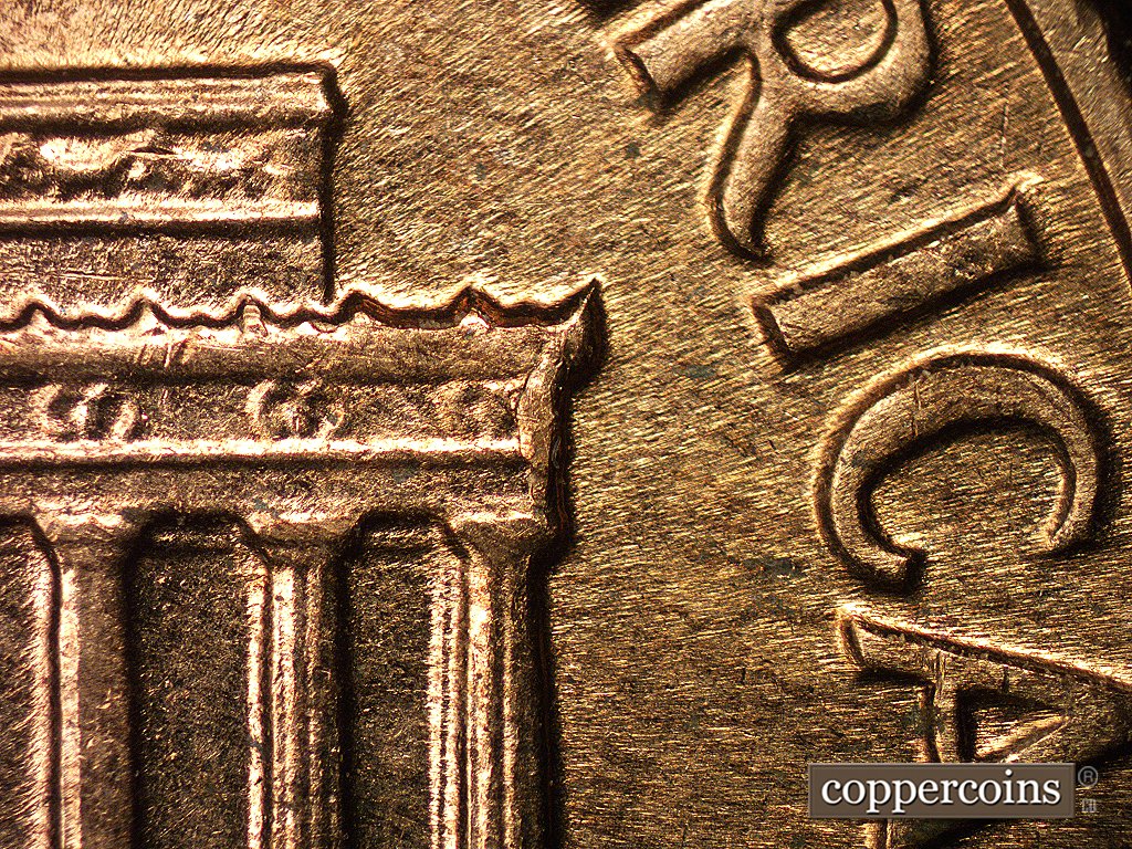Die-stage D marker on 1960D•1MM•003 showing A die chip shows in the right cornice.