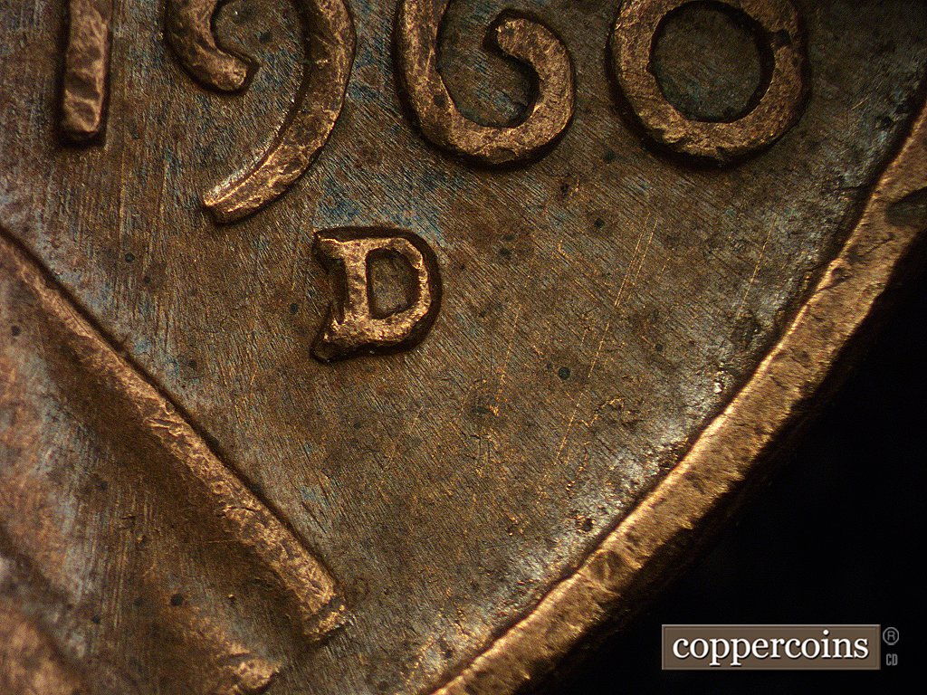 Die-stage A marker on 1960D•1MM•003 showing N-S die scratches through date and mint mark area. Doubling on the D is crisp but weak in appearance. It gets stronge….