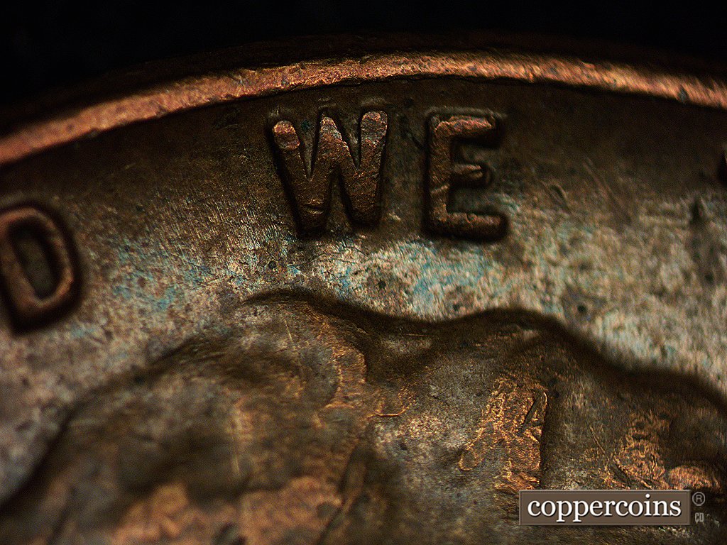 Die-stage A marker on 1960D•1MM•003 showing Small and fine die scratches are in the area of WE.