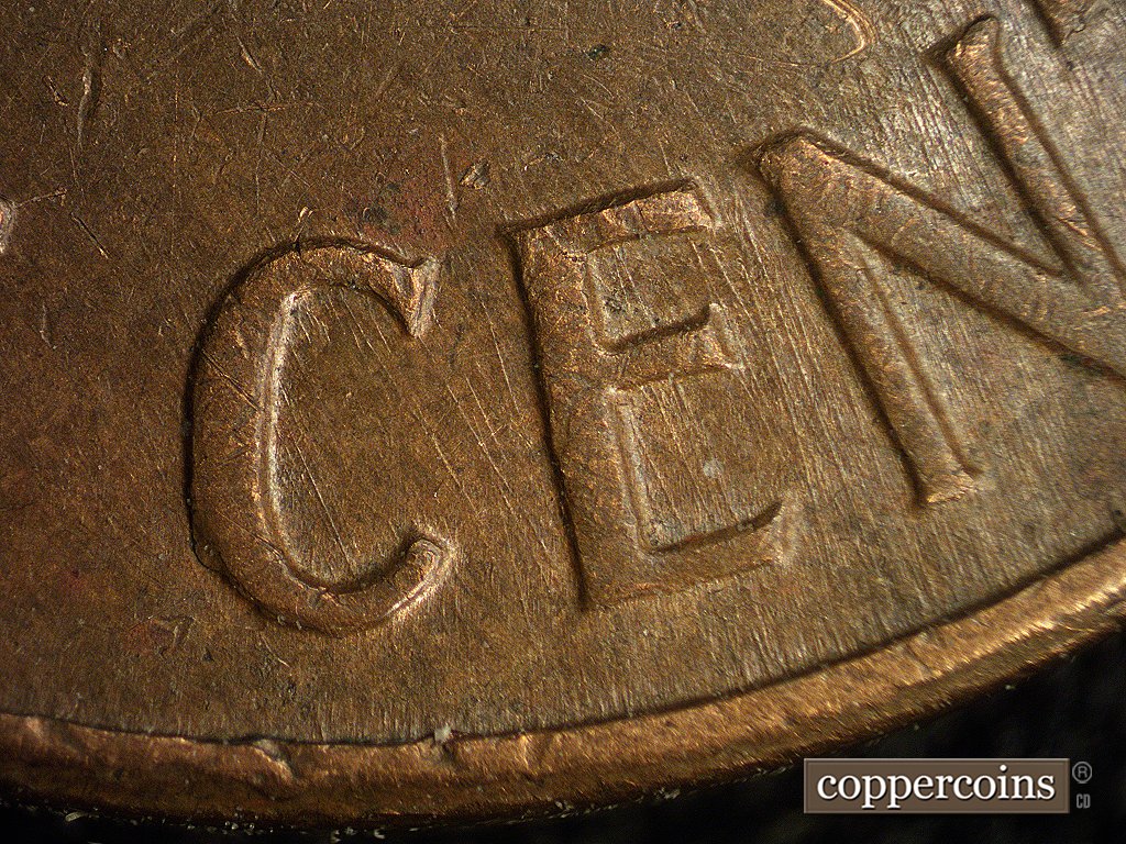 Die-stage A marker on 1960D•1MM•003 showing Heavier near vertical die scratches show through CENT.