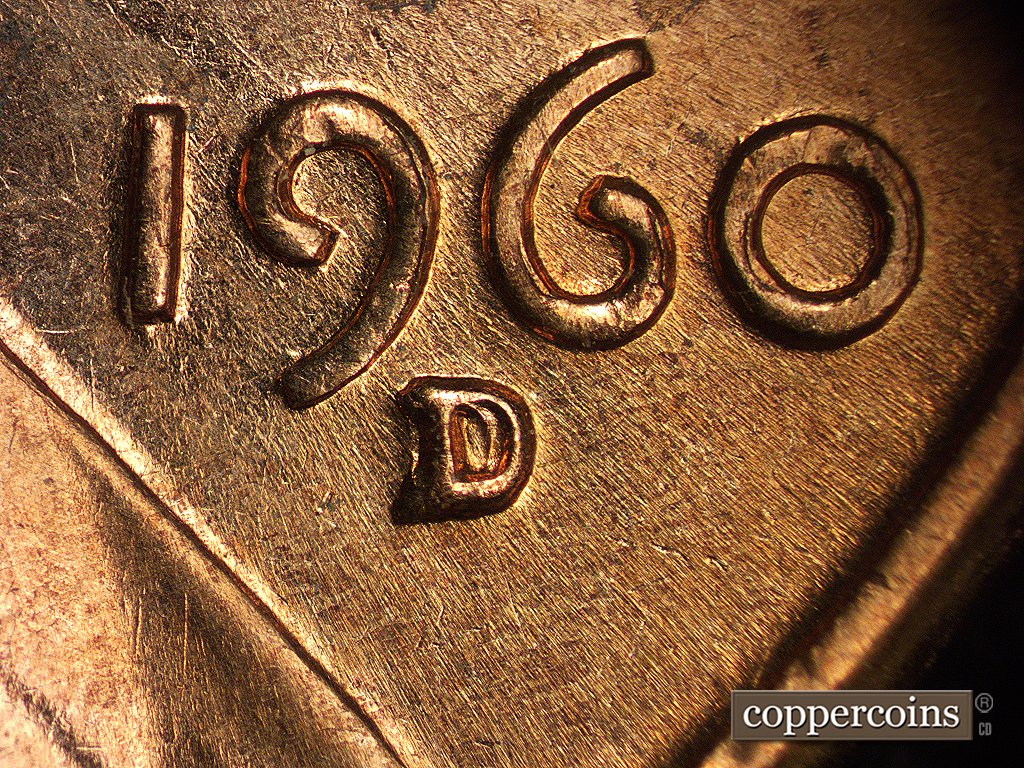 Die-stage D marker on 1960D•1MM•003 showing NW-SE die scratches show through the date and mint mark. secondary punch is stronger than in earlier stages.