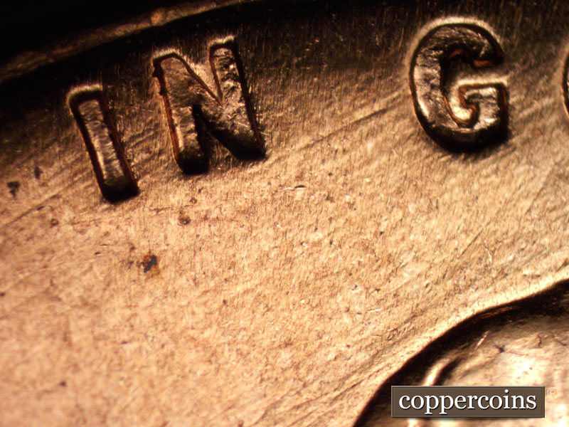 Die-stage B marker on 1960D•1MM•004 showing Die scratches under IN GOD.