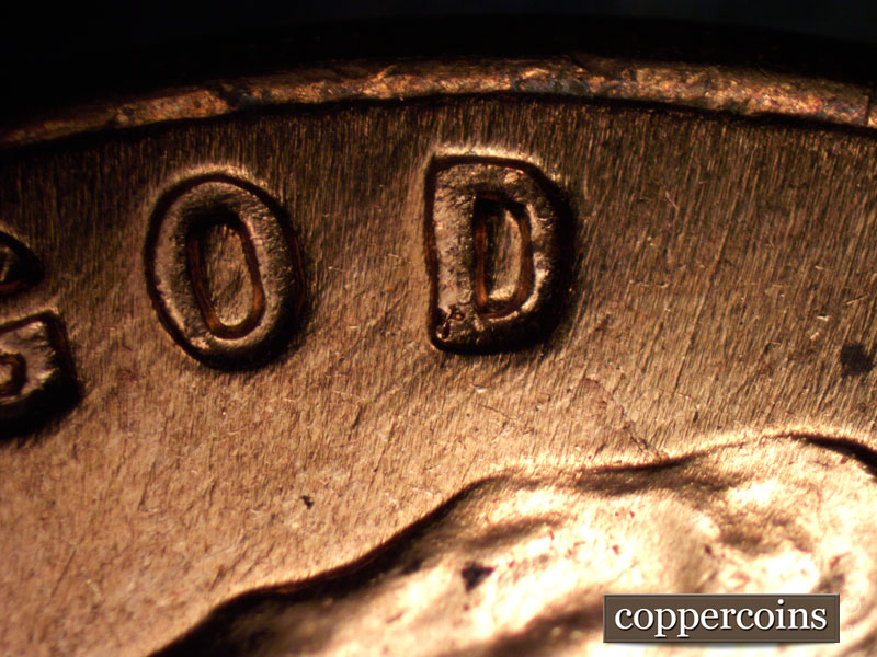 Die-stage B marker on 1960D•1MM•004 showing Die scratches under GOD.