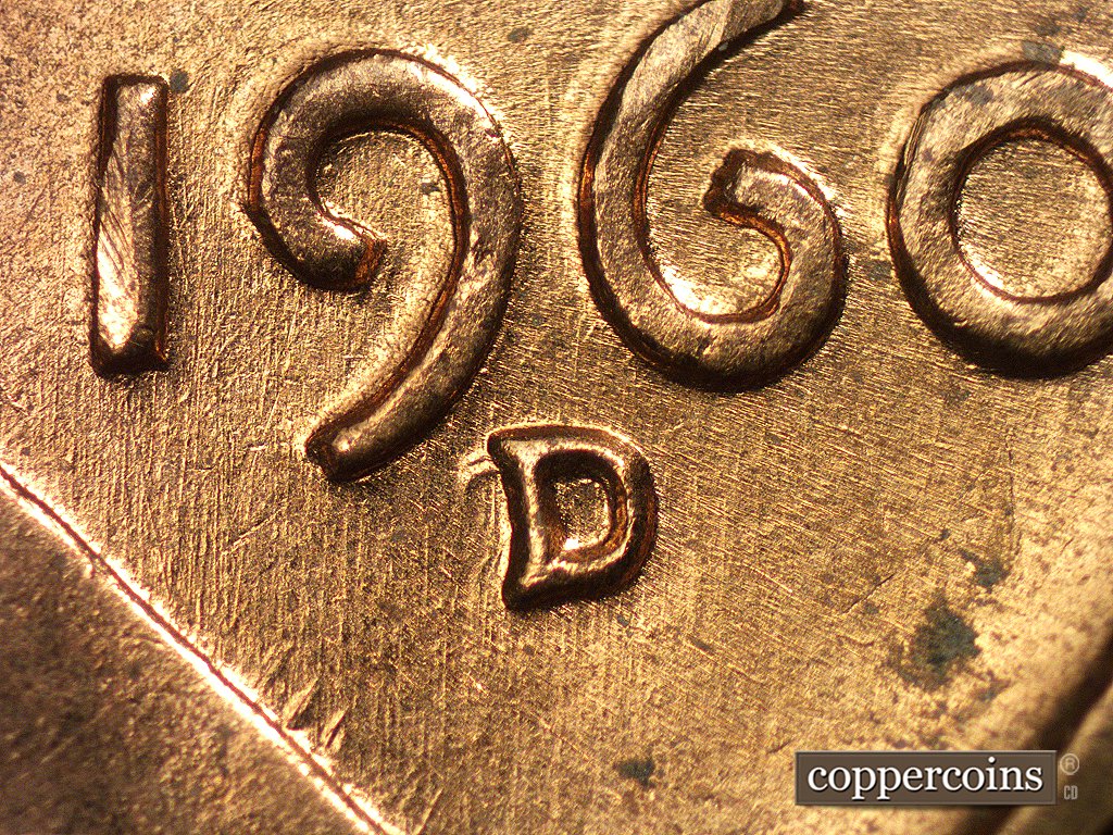 Die-stage A marker on 1960D•1MM•004 showing Sharp die scratches and die gouges from the front of the vest into the date area.