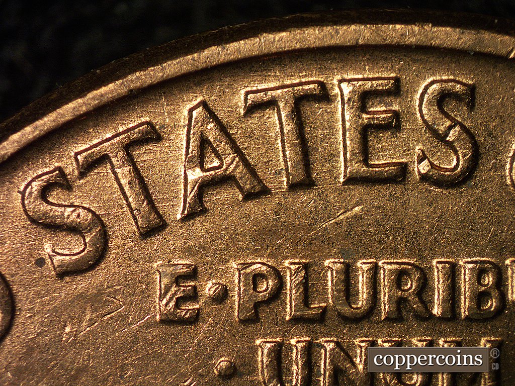 Die-stage A marker on 1960D•1MM•004 showing Very thin, sharp die scratches show through STA of STATES.
