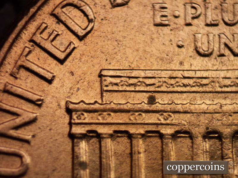 Die-stage A marker on 1960D•1MM•005 showing Left cornice area for reference.