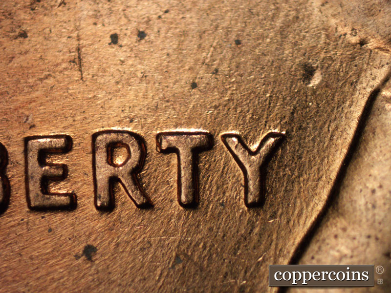 Die-stage C marker on 1960D•1MM•005 showing Die scratches through RTY i nLIBERTY.