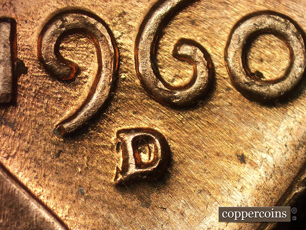 Die-stage B marker on 1960D•1MM•005 showing Numerous E-W die scratches through mint mark and date.