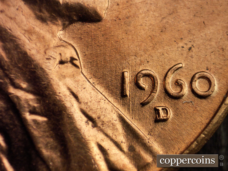 Die-stage B marker on 1960D•1MM•006 showing N/S die scratches through 1 indate.