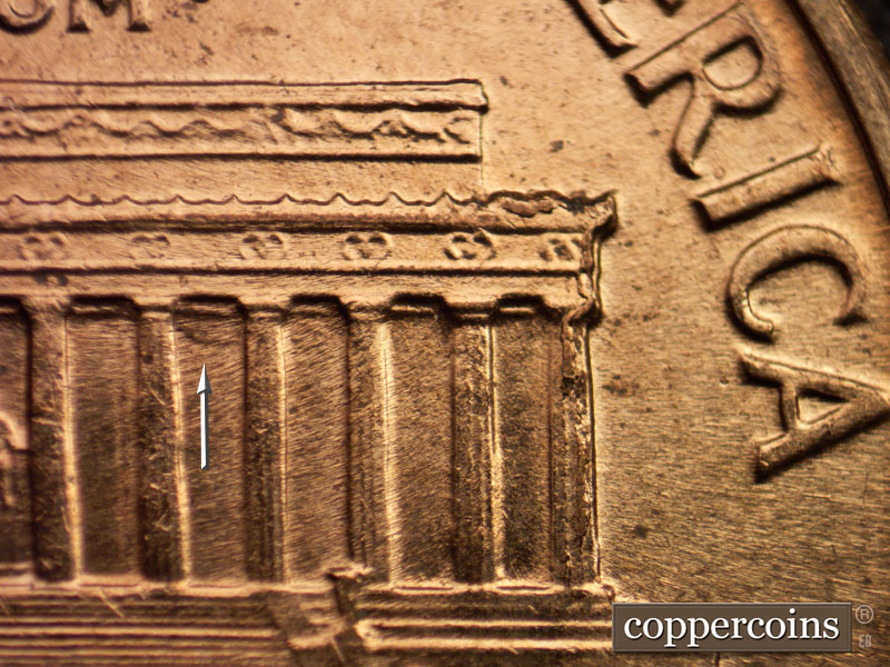 Die-stage B marker on 1960D•1MM•006 showing Die chipping on right cornice down column 12.