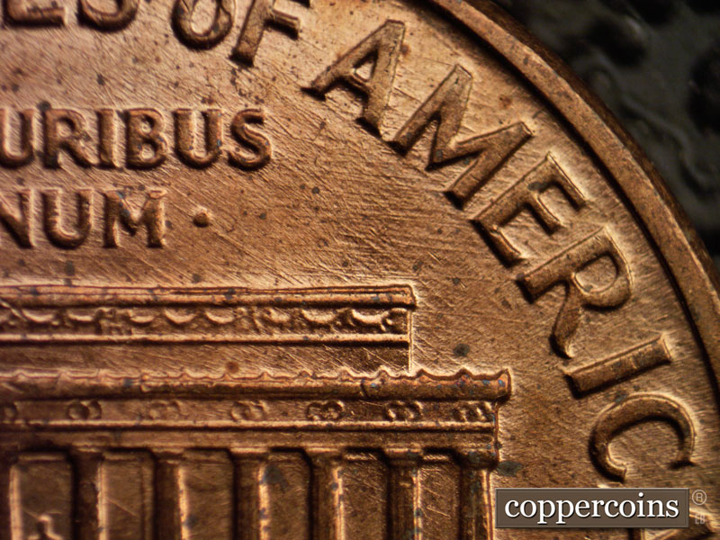 Die-stage D marker on 1960D•1MM•006 showing Intersecting die scratches under AMERICA.