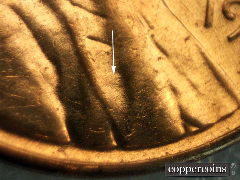 Die-stage B marker on 1960D•1MM•007 showing Light die scratches on lapel.