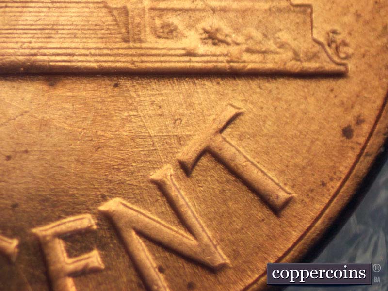 Die-stage B marker on 1960D•1MM•007 showing Intersecting die scratches above CENT.