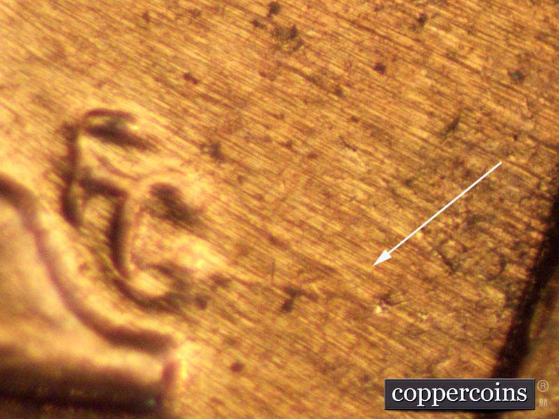 Die-stage B marker on 1960D•1MM•007 showing SE die scratches through designers initials.