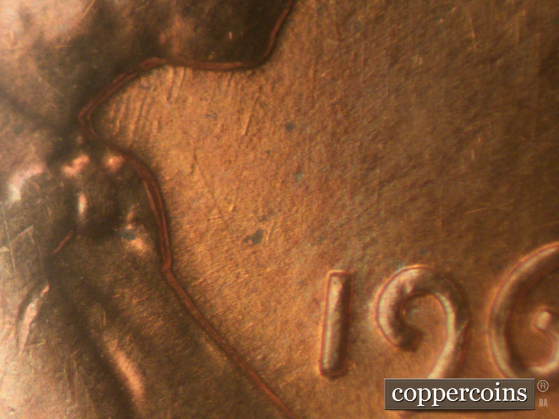 Die-stage B marker on 1960D•1MM•009 showing SSW die scratches from bottom of beard.