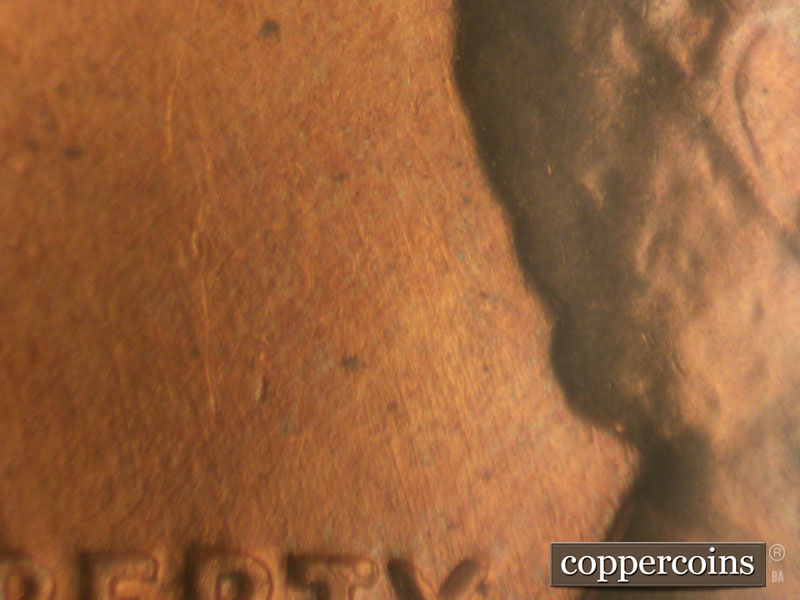 Die-stage B marker on 1960D•1MM•009 showing Light NNW die scratches above TY in LIBERTY.
