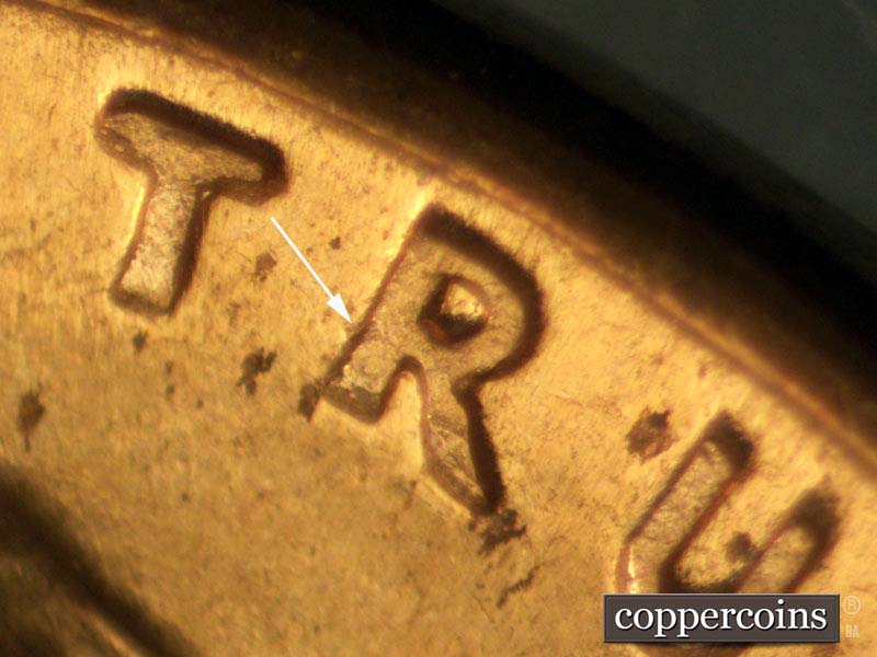 Die-stage B marker on 1960D•1MM•011 showing Small die gouge to left of R in TRUST.