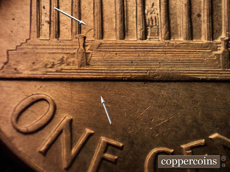 Die-stage B marker on 1960D•1MM•012 showing E/W die scratch under base. Die clash in lower bay 3.