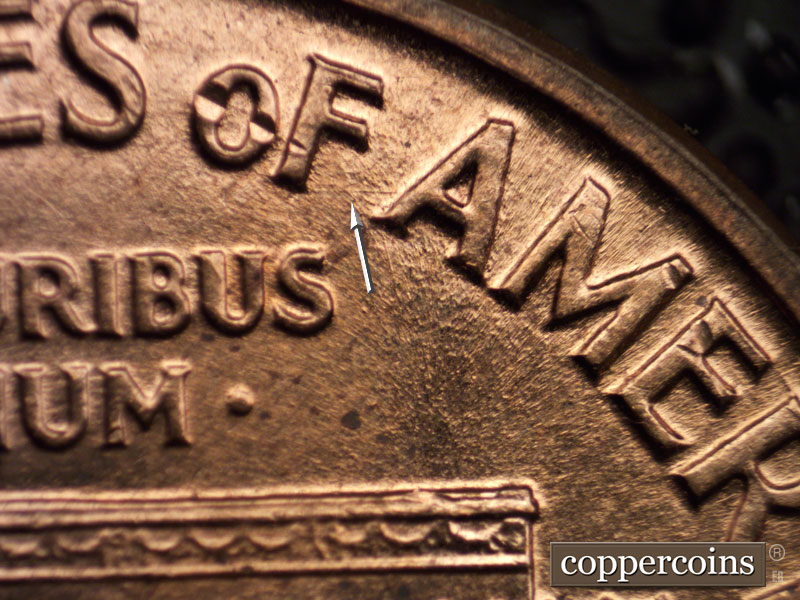 Die-stage C marker on 1960D•1MM•013 showing E/W die scratch from F in OF to A in AMERICA.