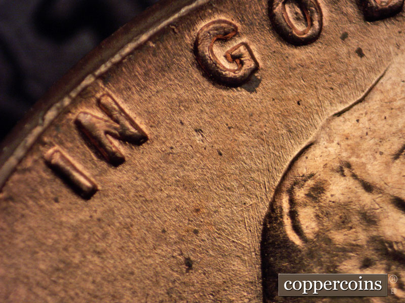 Die-stage B marker on 1960D•1MM•014 showing Very light die scratch through N on IN. Short light die scratches NNW from hair.