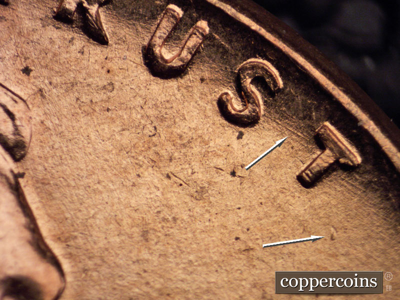 Die-stage B marker on 1960D•1MM•014 showing Die dot south of last T in TRUST.