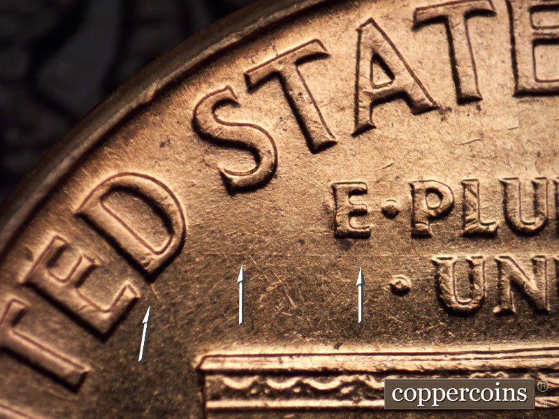 Die-stage B marker on 1960D•1MM•014 showing Light E/W die scratch from D in UNITED through E PLURIBUS UNUM.