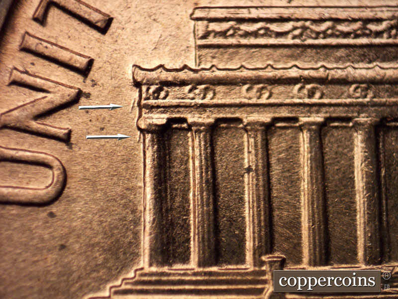 Die-stage B marker on 1960D•1MM•014 showing Two short SSW die scratches on left cornice and column #1.