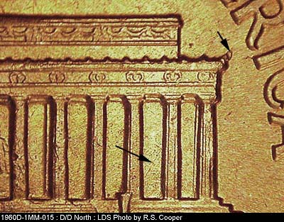 Die-stage C marker on 1960D•1MM•015 showing Die crack on column 12 to right cornice tip with a break at the tip.