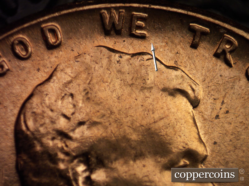 Die-stage A marker on 1960D•1MM•016 showing Short SE die scratches from E in WE.