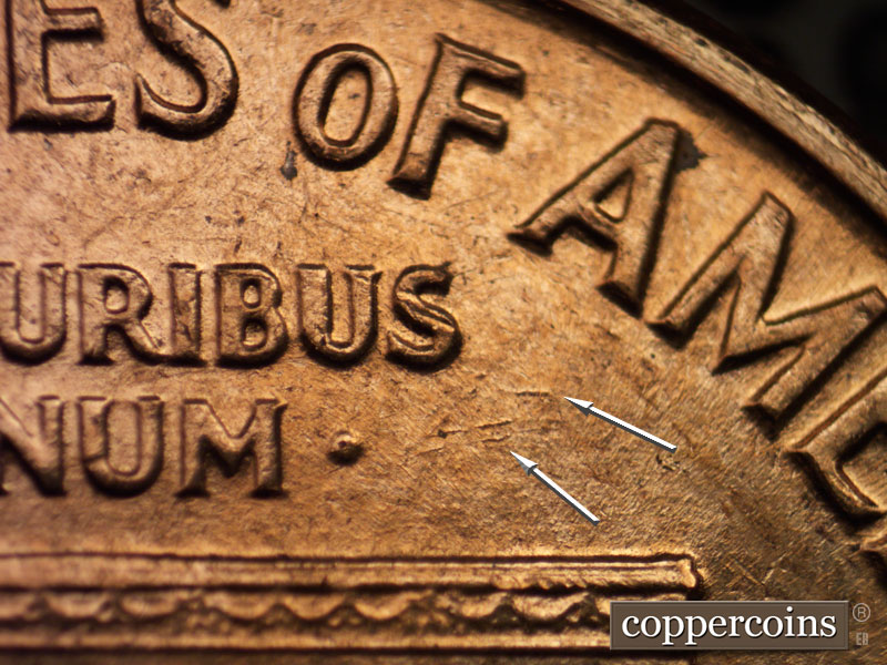 Die-stage A marker on 1960D•1MM•016 showing Numerous die gouges SE of S in PLURIBUS.
