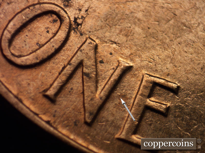 Die-stage A marker on 1960D•1MM•016 showing Die dot between N and E in ONE.