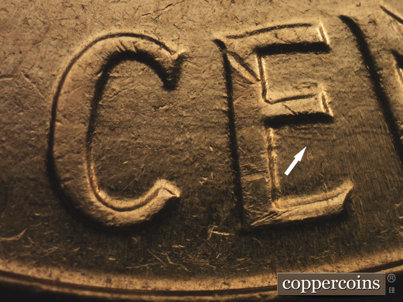 Die-stage B marker on 1960D•1MM•016 showing Light die gouges under middle leg of E in CENT.