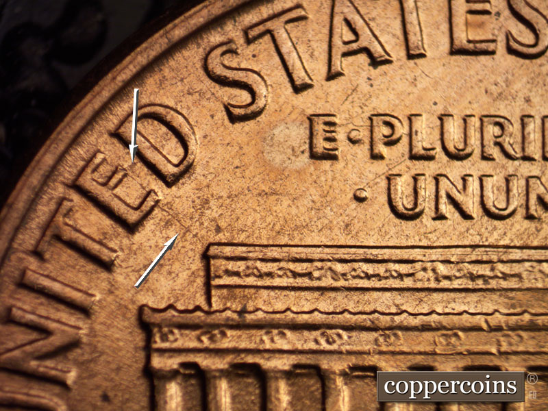 Die-stage C marker on 1960D•1MM•016 showing Die crack from left roof through E in UNITED.