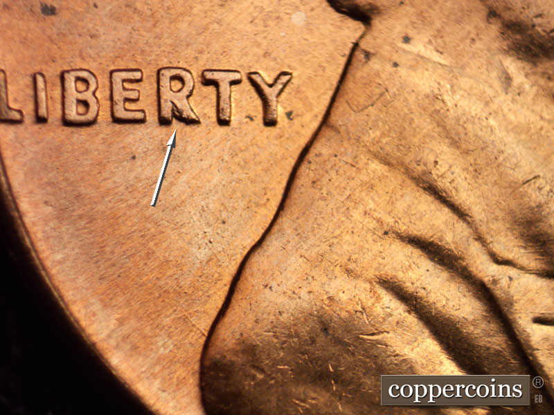Die-stage B marker on 1960D•1MM•017 showing Die break on lower R on LIBERTY.
