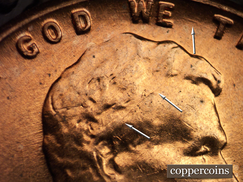 Die-stage B marker on 1960D•1MM•017 showing ESE die scratch between WE and TRUST.