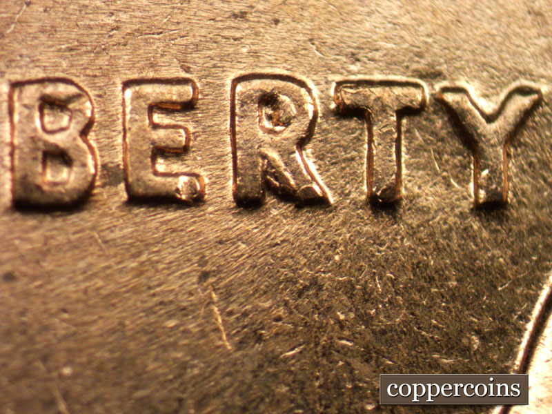 Die-stage C marker on 1960D•1MM•017 showing Die break in R of LIBERTY.