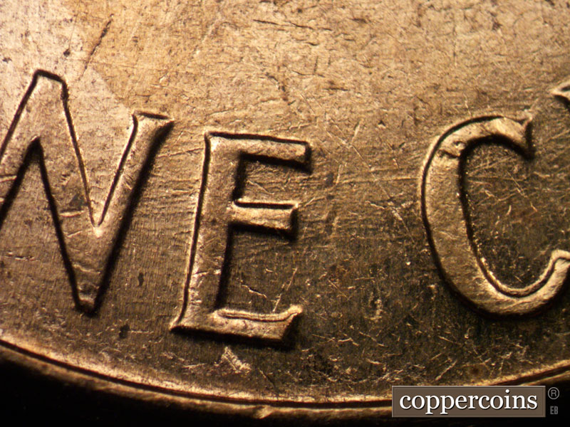 Die-stage C marker on 1960D•1MM•017 showing Die scratches through NE in ONE into C of CENT.