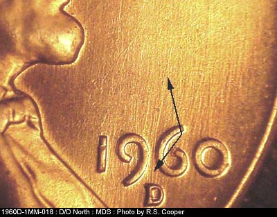 Die-stage B marker on 1960D•1MM•018 showing A long fading die scratch from mintmark NE between 96 of date. (.